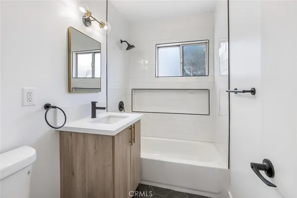 a view of a kitchen with a sink and a stove top oven