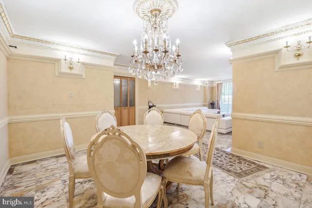 a utility room with granite countertop cabinets washer and dryer