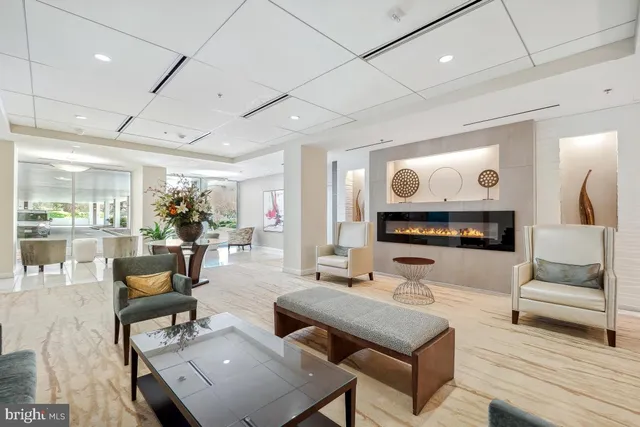 a lobby with furniture and a large window