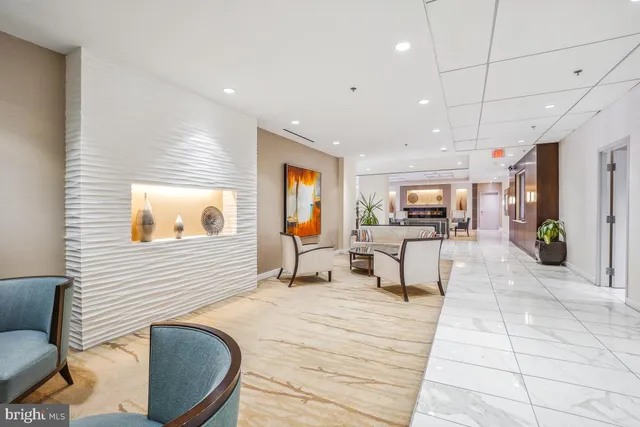 a spacious bedroom with a large bed and a flat screen tv