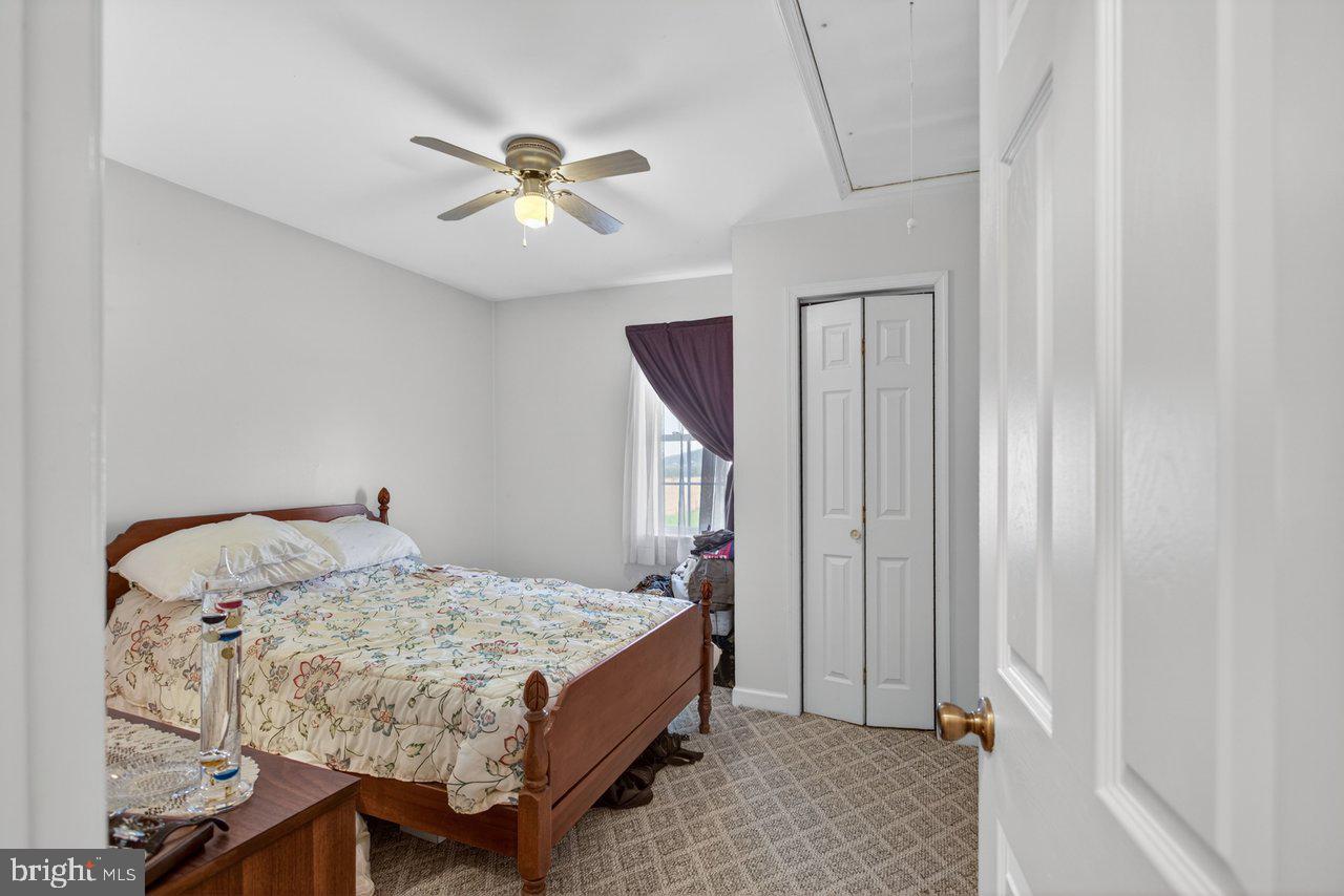1751 Orchard Road Mount Jackson, VA 22842 - Photo 17 of 30 a bedroom with a bed and a window