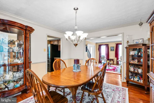 a kitchen with stainless steel appliances a stove a sink island and a refrigerator