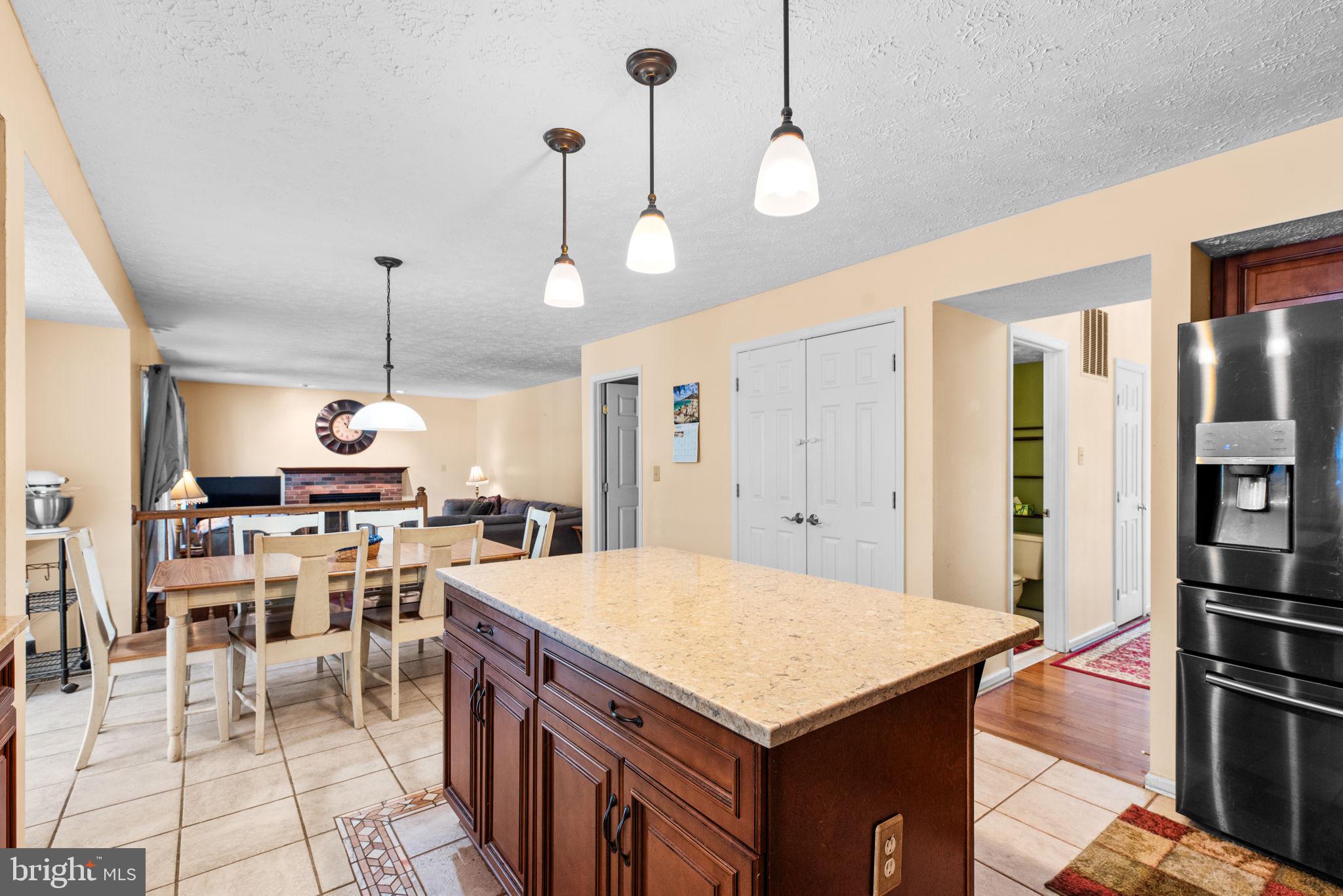 9464 Joppa Pond Road Baltimore, MD 21234 - Photo 18 of 66 a kitchen with a table chairs and a view of kitchen