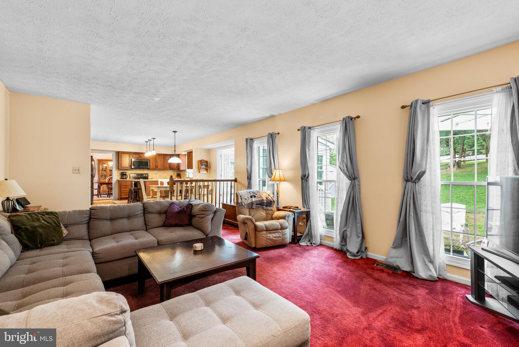 9464 Joppa Pond Road Baltimore, MD 21234 - Photo 24 of 66 a living room with furniture and a large window