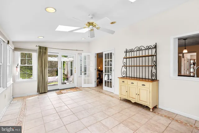 a bedroom with a bed and a lamp