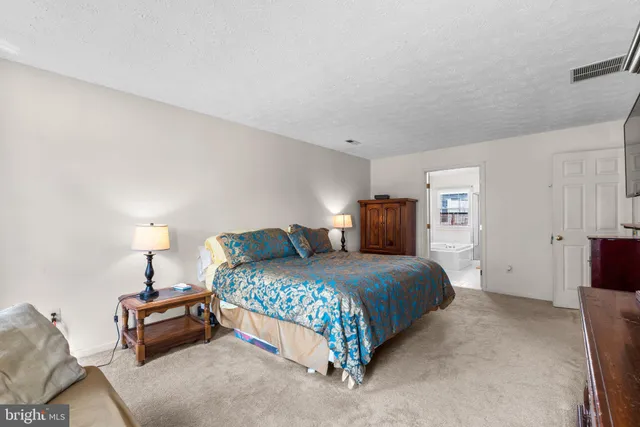 a bedroom with a bed and a closet