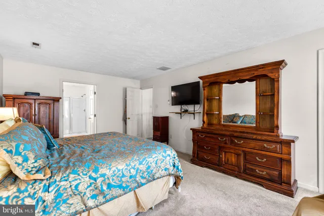 an empty room with furniture and a window