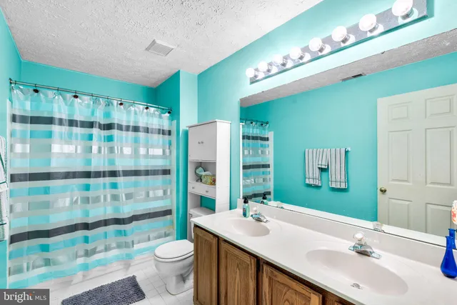 a dining room with a table and chairs