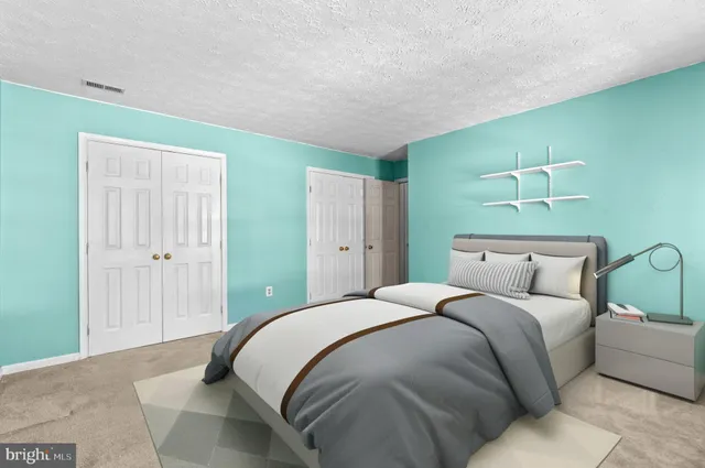 a dining room with a table and chairs