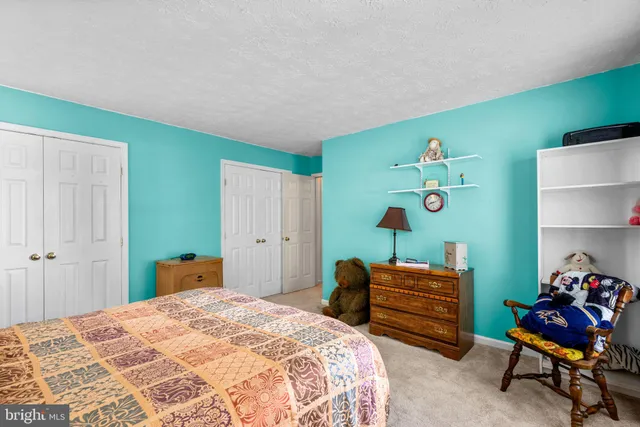 a view of a patio with chairs and a table