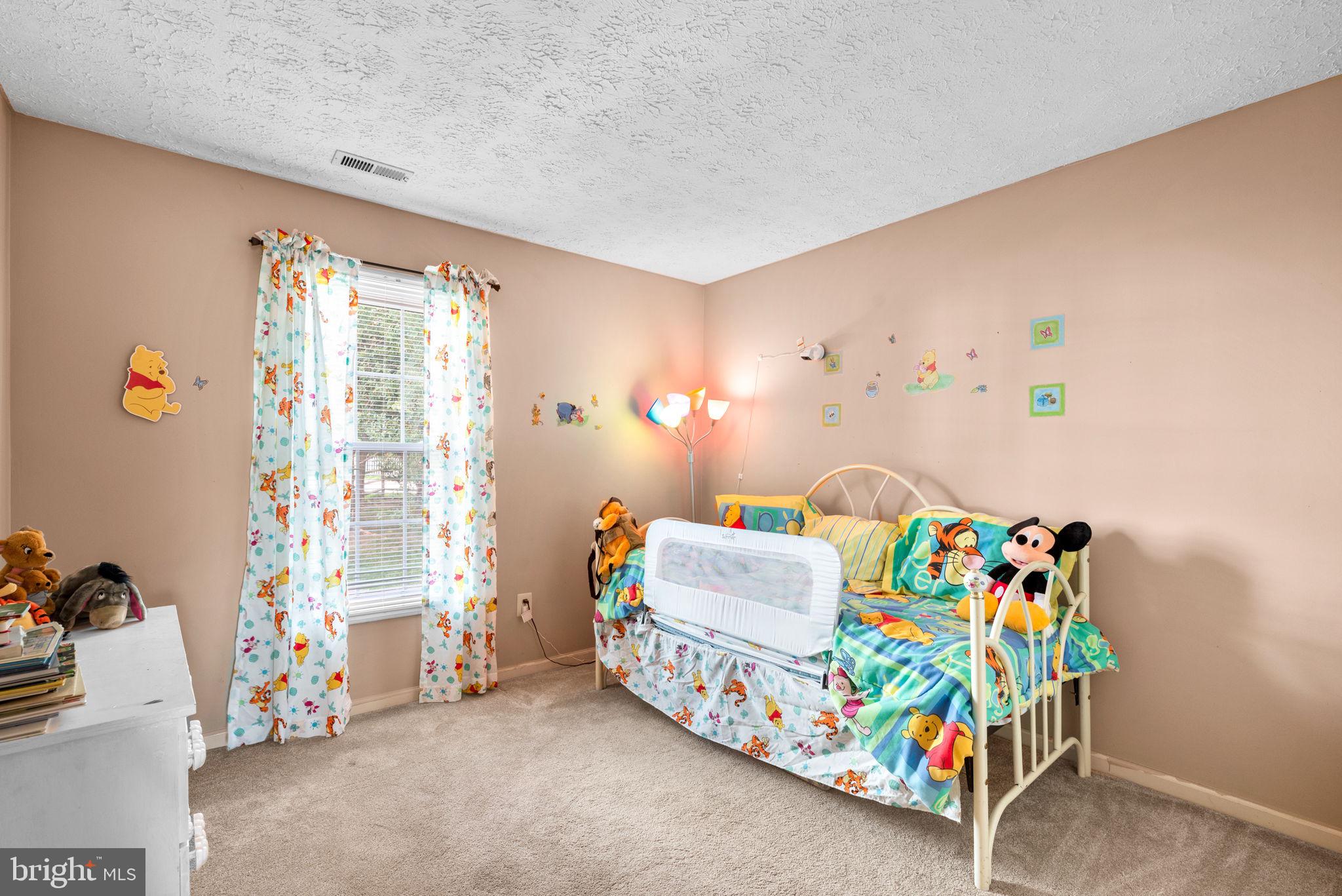 9464 Joppa Pond Road Baltimore, MD 21234 - Photo 49 of 66 a bedroom with a bed and a window