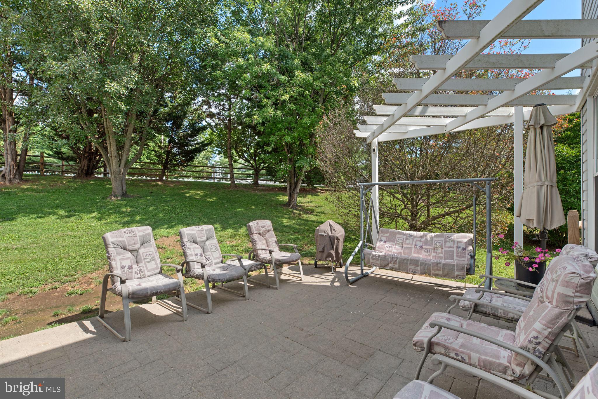 9464 Joppa Pond Road Baltimore, MD 21234 - Photo 58 of 66 a view of a patio with chairs and a table