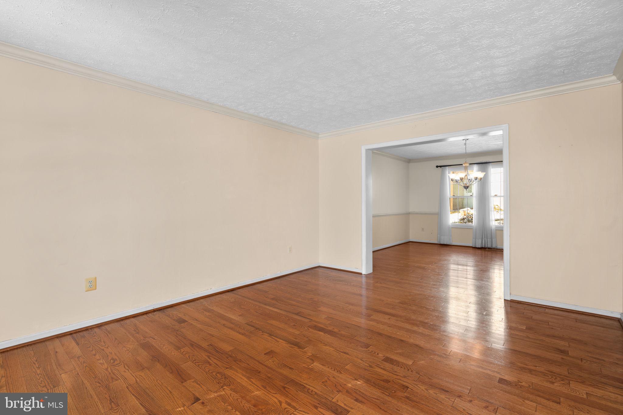9464 Joppa Pond Road Baltimore, MD 21234 - Photo 8 of 66 an empty room with wooden floor and windows