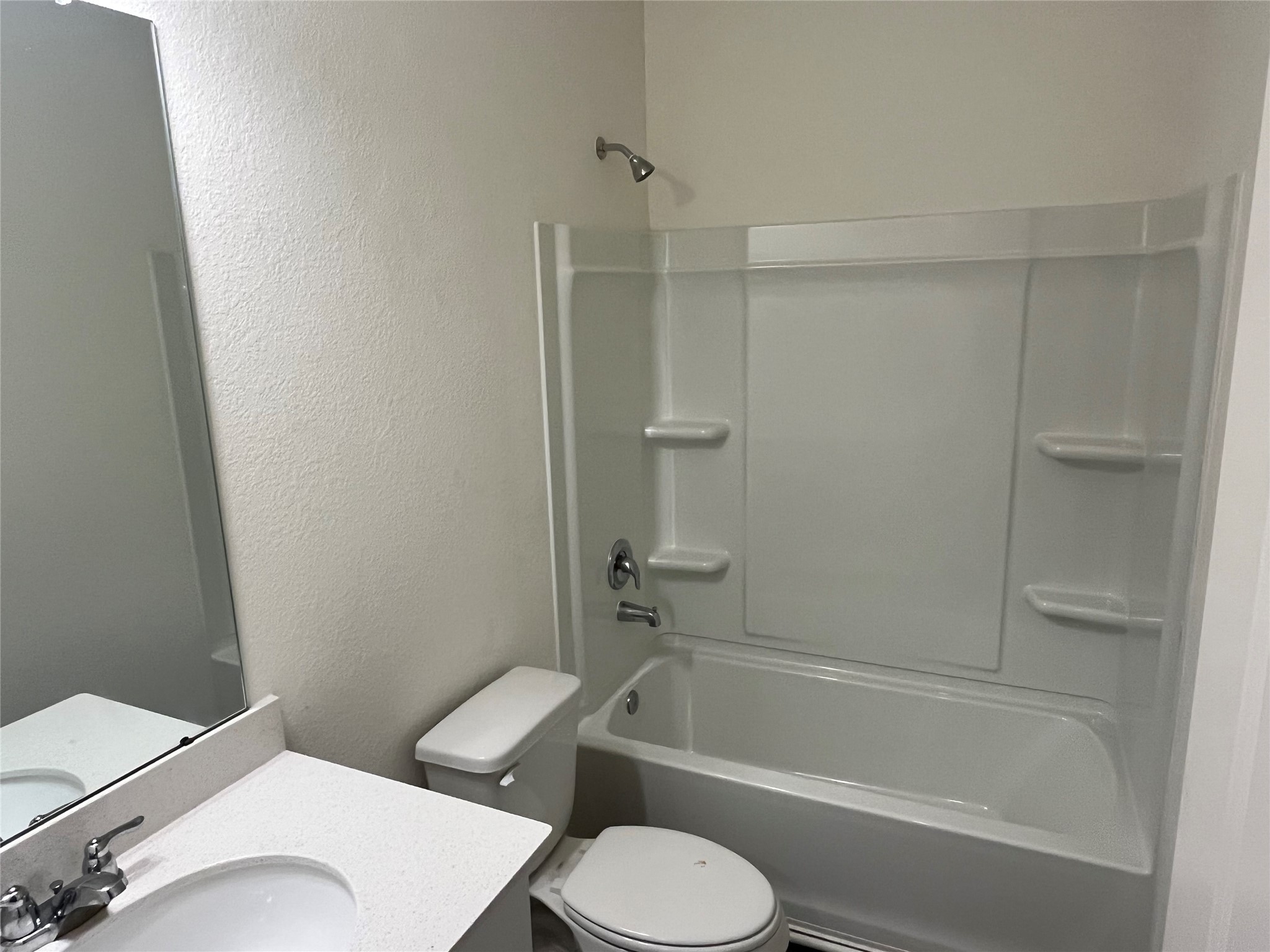 14715 Peaceful Way New Caney, TX 77357 - Photo 17 of 17 a white toilet and tub sitting next to a bathroom sink