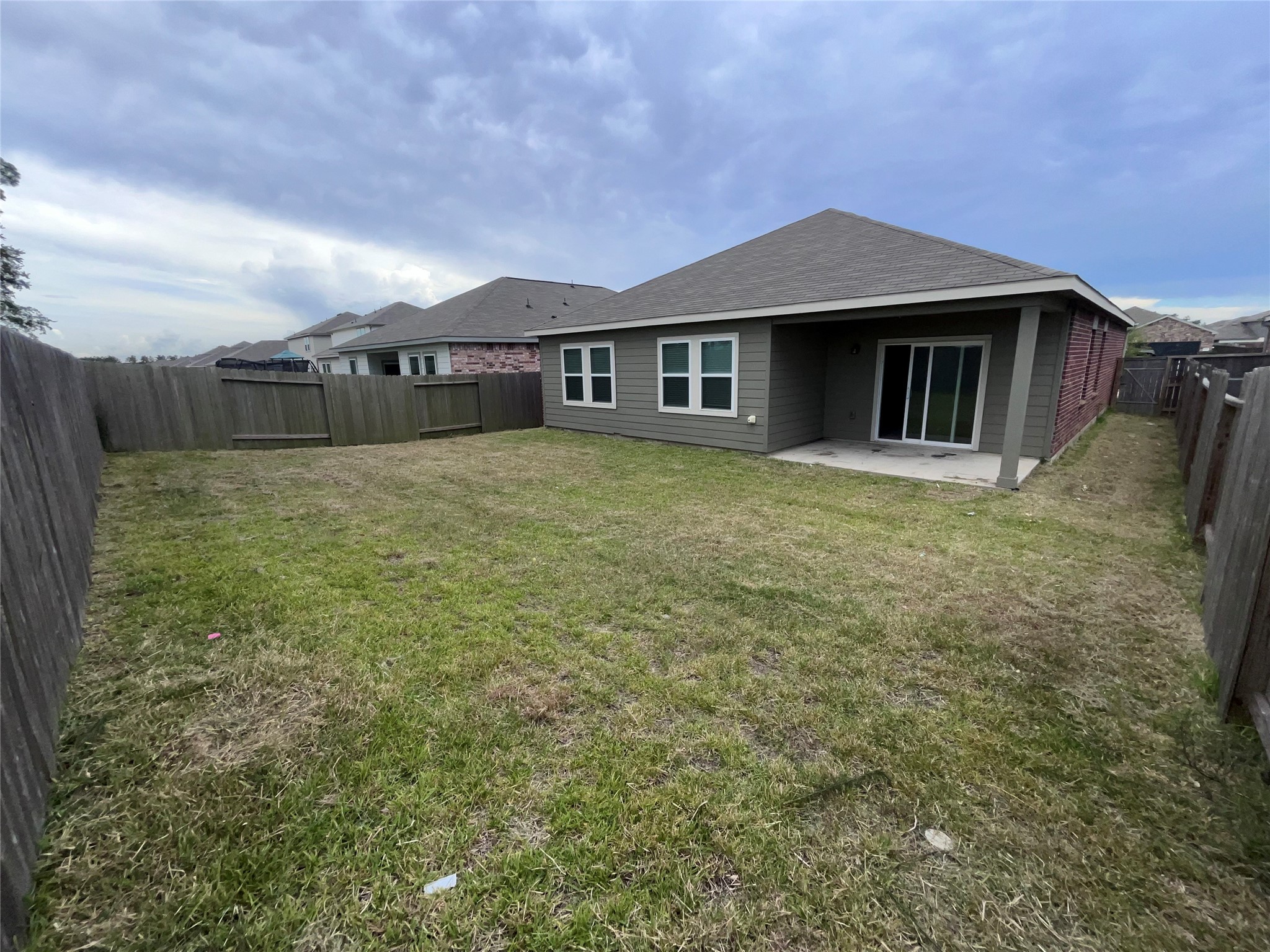 14715 Peaceful Way New Caney, TX 77357 - Photo 5 of 17 a house that has a big yard in front of it