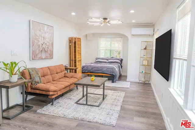 a living room with furniture and a rug