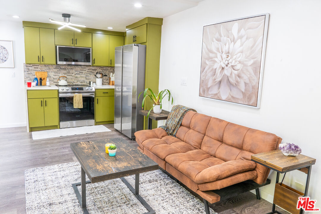 348 Laveta Terrace, Unit 2 Los Angeles, CA 90026 - Photo 14 of 20 a living room with furniture and a flat screen tv