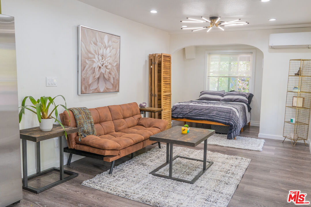 348 Laveta Terrace, Unit 2 Los Angeles, CA 90026 - Photo 17 of 20 a living room with furniture and wooden floor