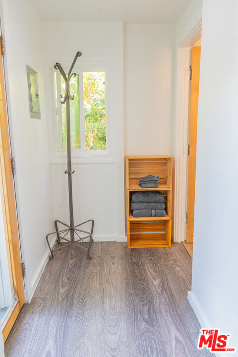348 Laveta Terrace, Unit 2 Los Angeles, CA 90026 - Photo 18 of 20 a view of room with window and wooden floor