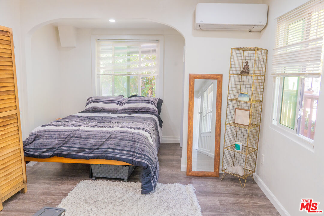 348 Laveta Terrace, Unit 2 Los Angeles, CA 90026 - Photo 20 of 20 a bedroom with a bed and a window