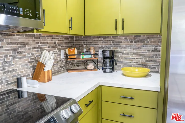 a bathroom with a sink a bathtub and a vanity