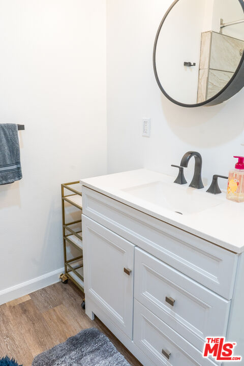 348 Laveta Terrace, Unit 2 Los Angeles, CA 90026 - Photo 5 of 20 a bathroom with a sink and a mirror