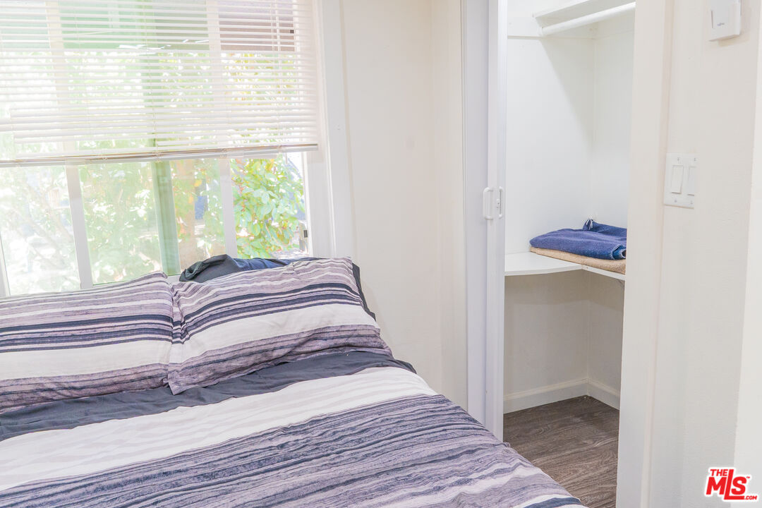 348 Laveta Terrace, Unit 2 Los Angeles, CA 90026 - Photo 6 of 20 a bedroom with a bed and a window
