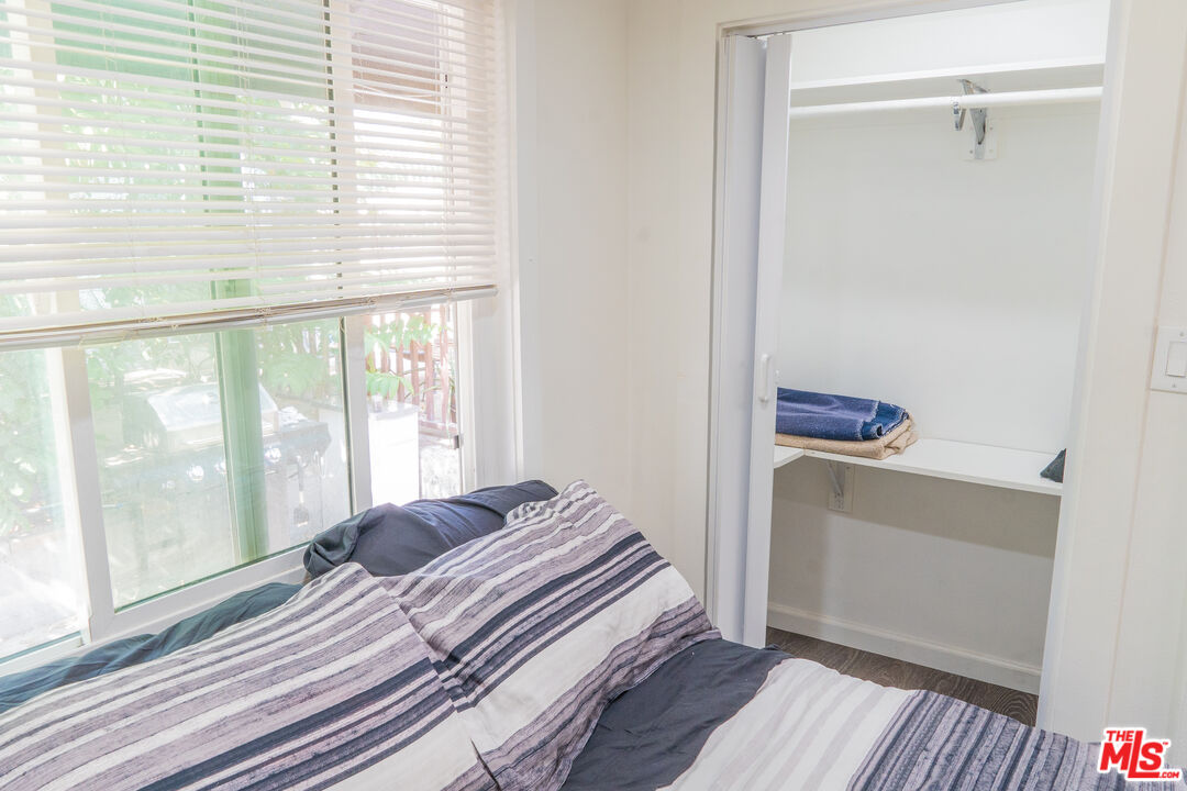348 Laveta Terrace, Unit 2 Los Angeles, CA 90026 - Photo 7 of 20 a bedroom with a bed and a window with outer view