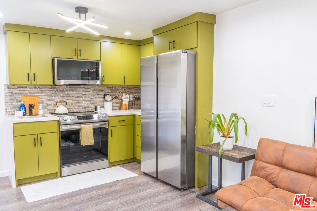 348 Laveta Terrace, Unit 2 Los Angeles, CA 90026 - Photo 10 of 20 a kitchen with a refrigerator and a sink