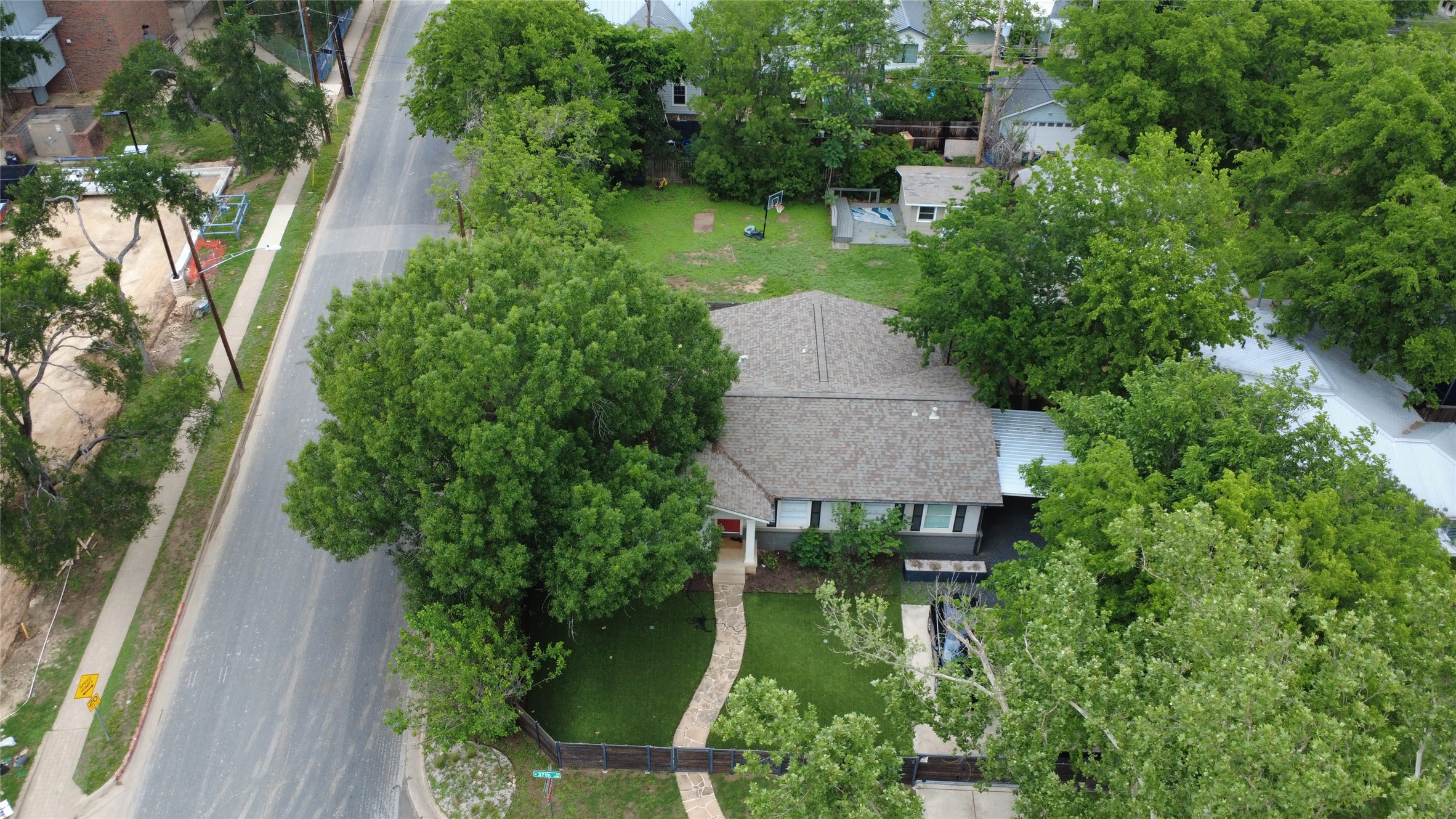 1916 West 37th Street Austin, TX 78731 - Photo 4 of 8 an aerial view of a house with swimming pool and garden