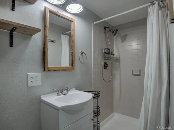 a view of kitchen with sink and microwave