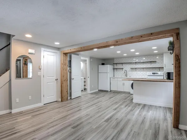 a view of kitchen with wooden floor and windows