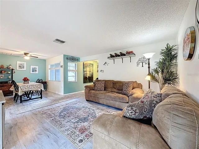 a view of a livingroom with furniture and window