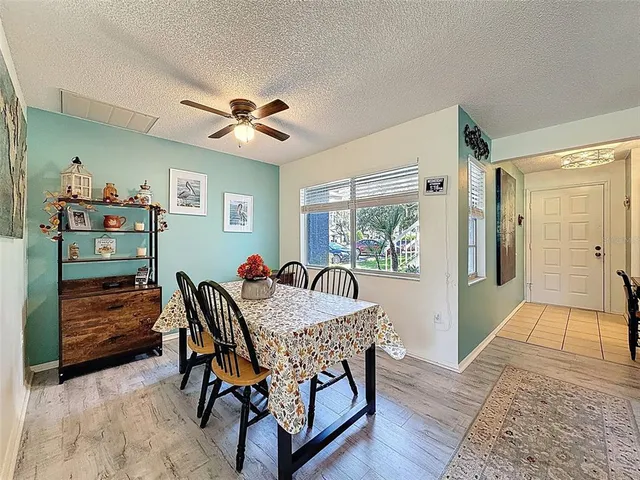 a dining room with furniture and window