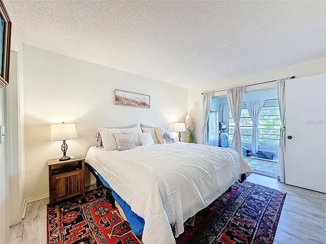 a bathroom with a sink a toilet and shower curtain