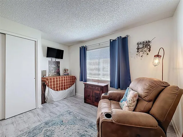 a en suite bathroom with a tub sink and mirror