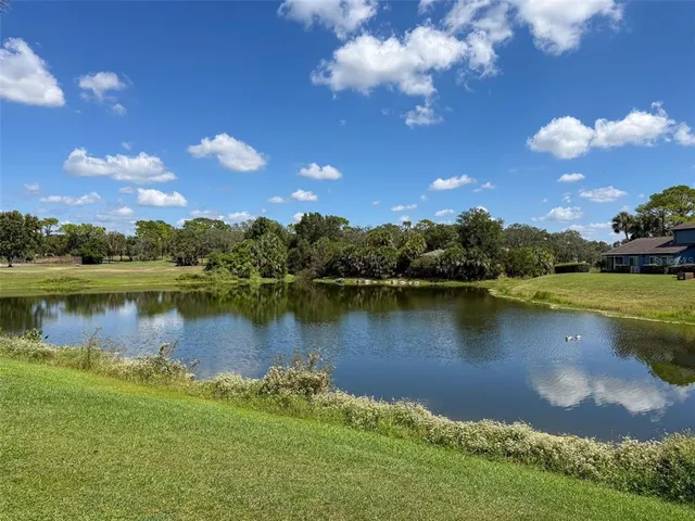 an aerial view of a house with swimming pool patio and mountain view