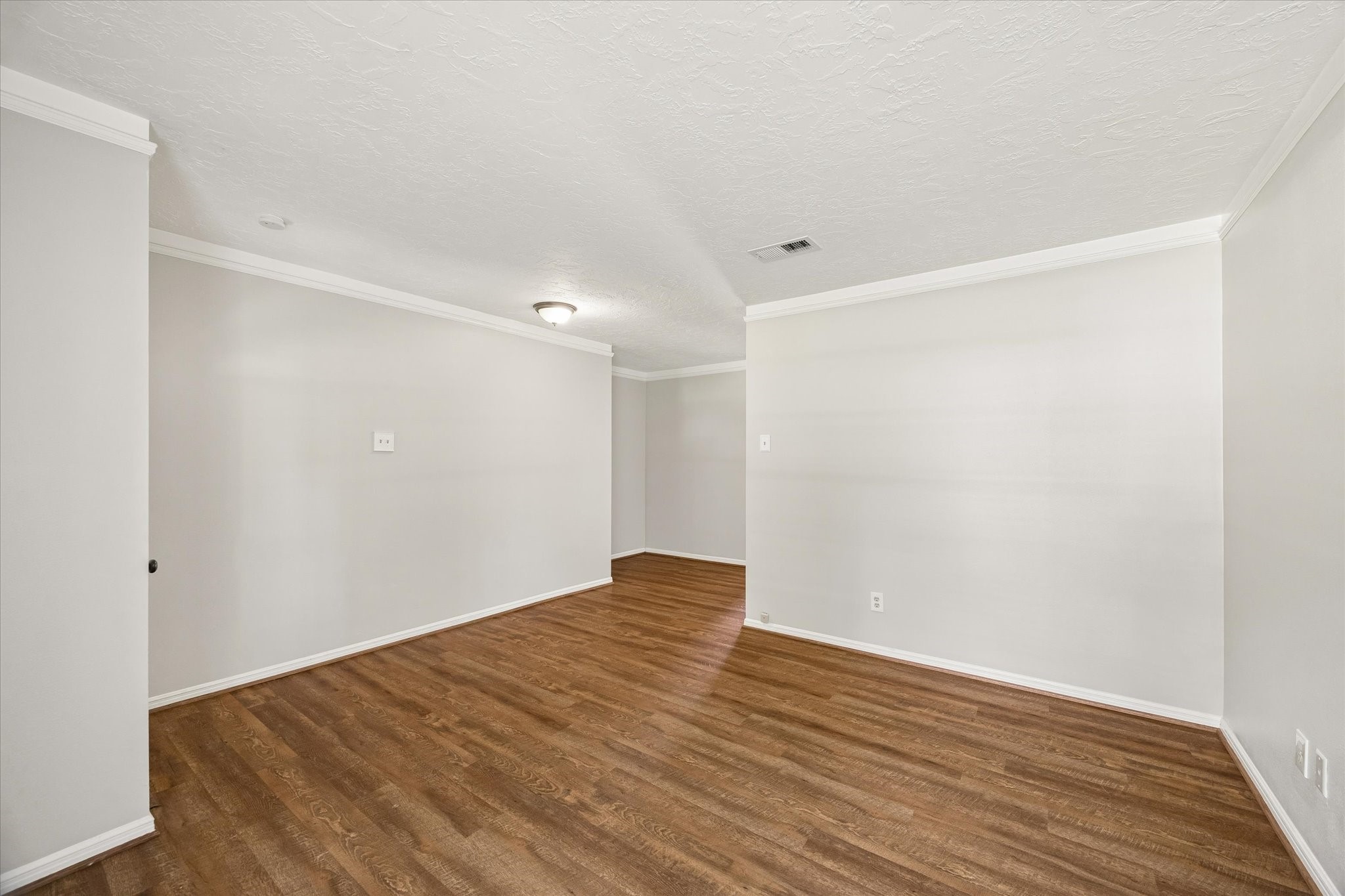 25114 Spring Ridge Drive Spring, TX 77386 - Photo 5 of 24 a view of an empty room with wooden floor