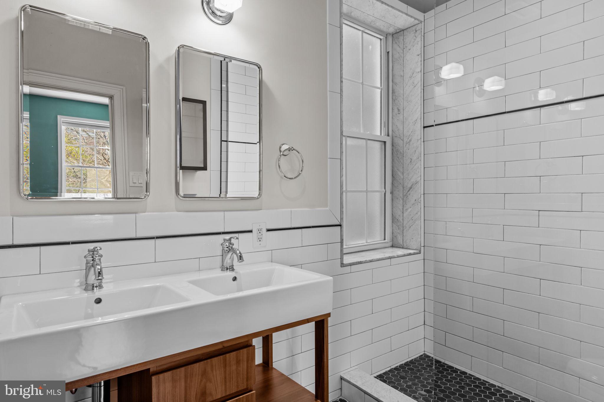 828 South 5th Street Philadelphia, PA 19147 - Photo 16 of 27 a bathroom with a sink shower and a mirror