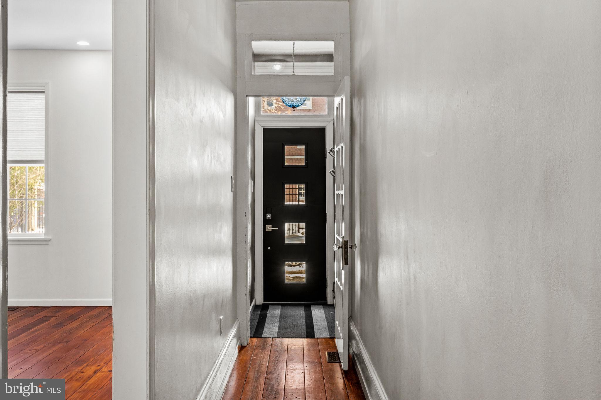 828 South 5th Street Philadelphia, PA 19147 - Photo 2 of 27 a view of a hallway with wooden floor and staircase