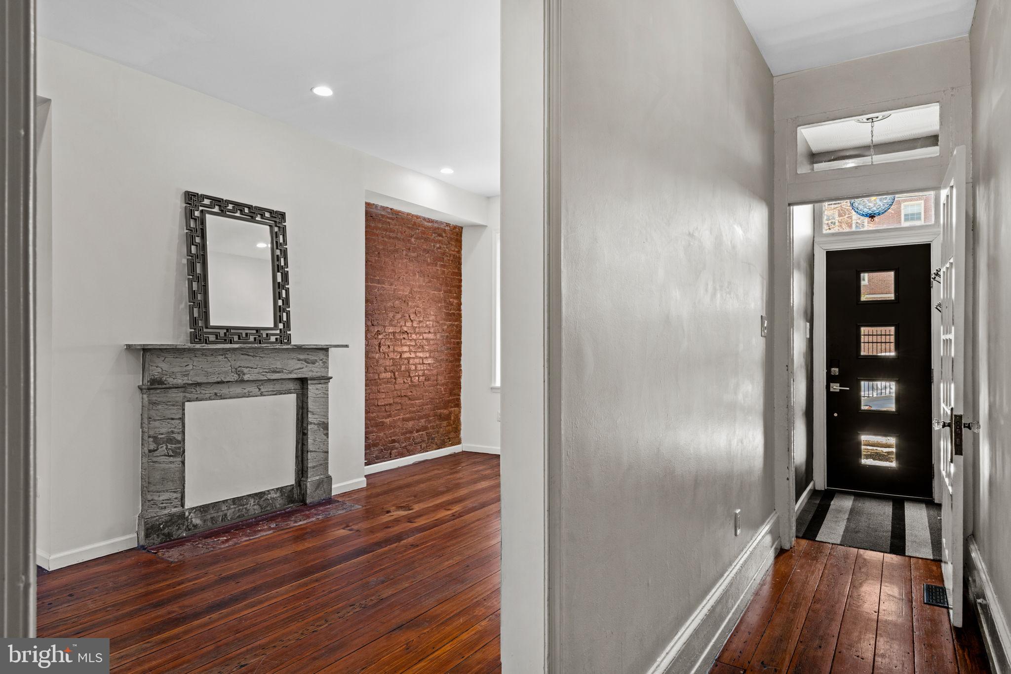 828 South 5th Street Philadelphia, PA 19147 - Photo 3 of 27 a view of kitchen and hallway with wooden floor