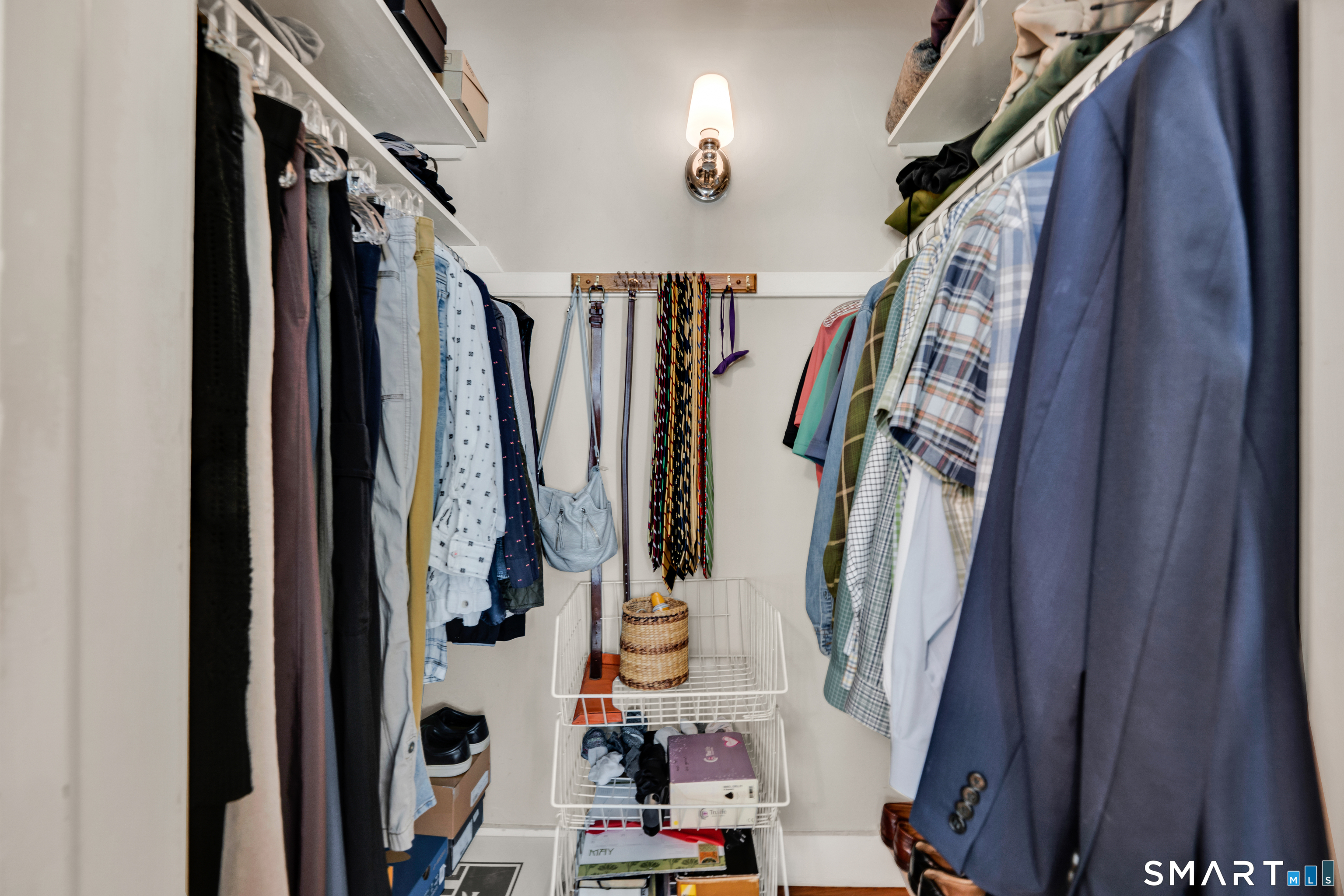 44 Beverly Road Wethersfield, CT 06109 - Photo 20 of 31 a view of walk in closet with clothes and shoes
