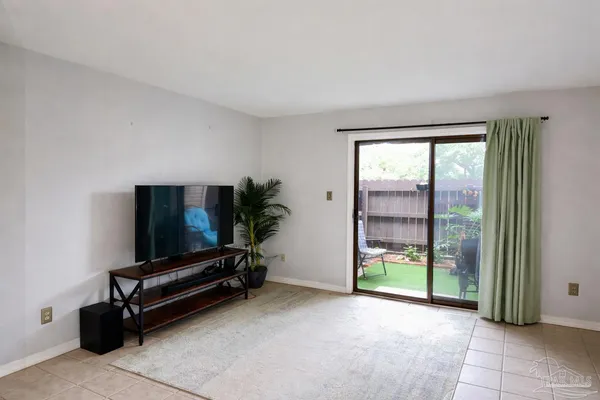 a view of kitchen with furniture and electronic appliances