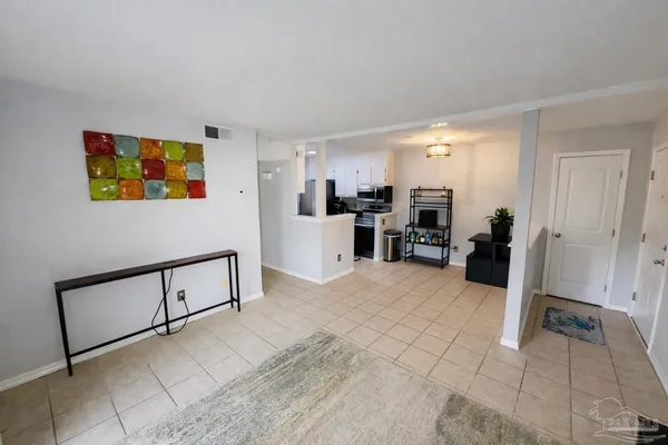 a view of a swimming pool and lounge chairs