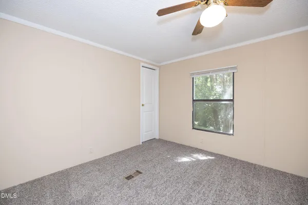 an empty room with a empty space and windows