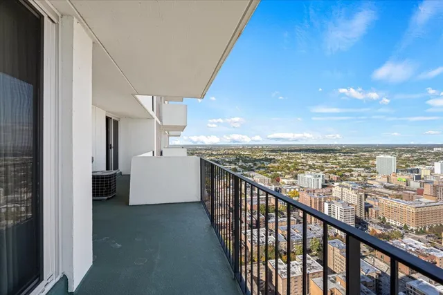 a view of balcony with city