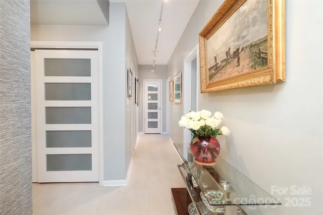 a vase of flowers sitting on a floor
