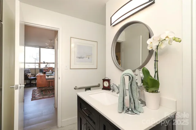 a bathroom with a sink and a mirror