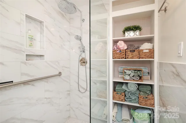 a bathroom with a bathtub and a shower