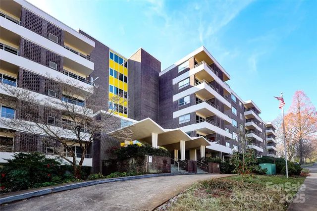 a front view of building with yard